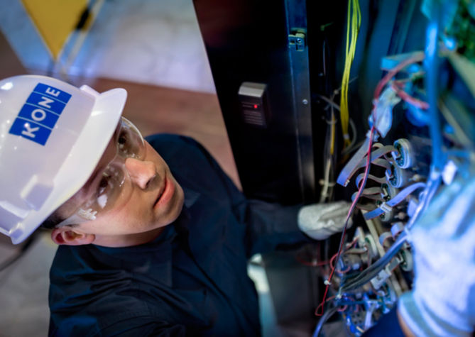 Maintenance technician working on cables of an elevator - KONE